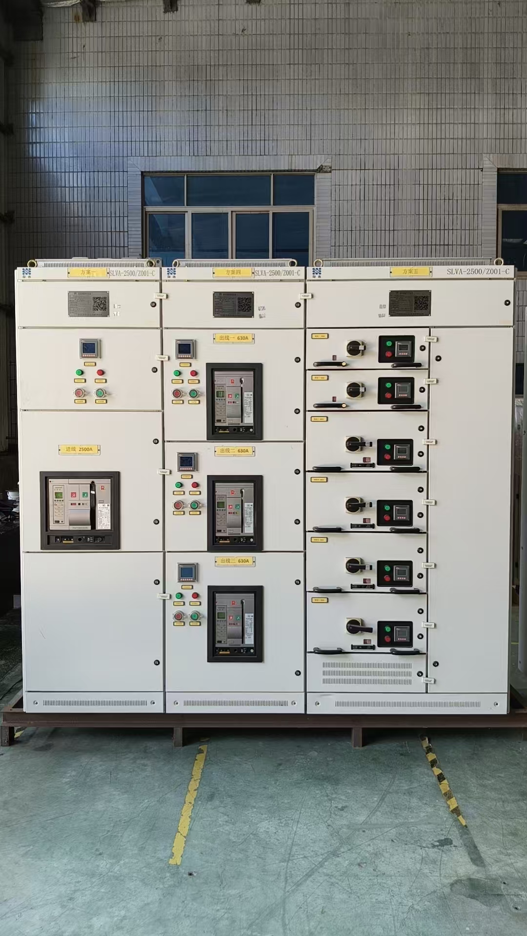 Inside a low voltage switchgear compartment showing breaker wiring and protective conductors